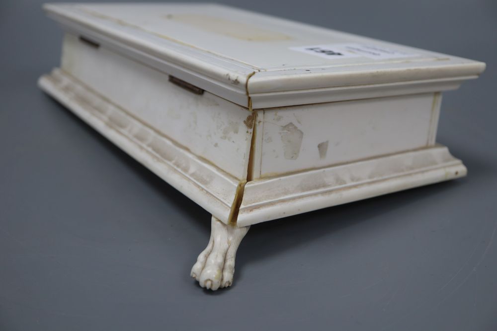 An ivory box with gold hinges, width 17cm height 8cm